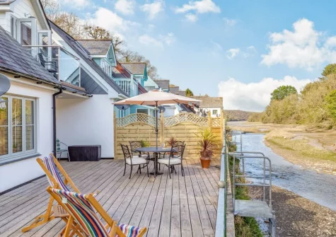 The decked terrace, barbecue, alfresco dining & outdoor sitting area at Creekside, Little Petherick