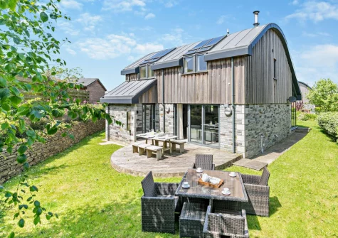 The decked patio, alfresco dining area & garden at Crigmorrick, Trevone