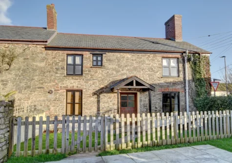 Cross Farm Cottage welcomes pets, part of the small garden has been fenced off