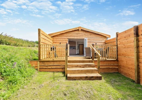 The decked terrace, alfresco dining area & garden at Cumberland, Westward Ho!