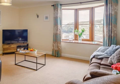 Curnows, Portreath is a stunning four-bedroom beachfront house with spectacular sea views. Enjoy direct beach access, stylish interiors, and a balcony overlooking the Atlantic. Perfect for families seeking an unforgettable Cornish coastal escape.