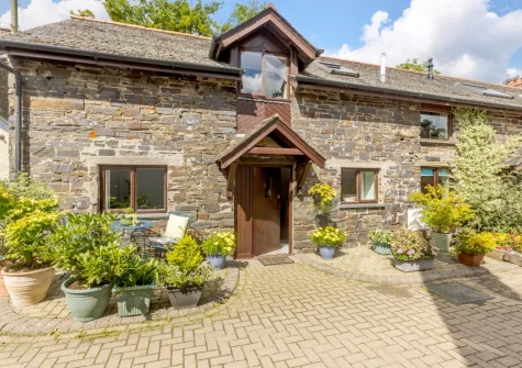 Dairy Cottage is a homely stone cottage with exposed beams & stonework