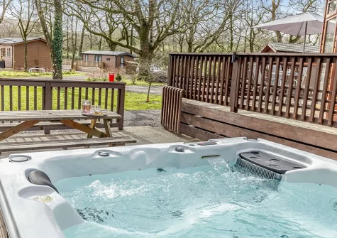 The decked patio & hot tub at Dartmoor Lodge, Meldon Lodge Park, Meldon