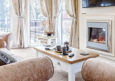 Dartmoor Lodge, Meldon Lodge Park, Meldon is a stylish three-bedroom retreat with private hot tub and enclosed decking. This modern lodge offers luxurious comfort on the doorstep of Dartmoor National Park, perfect for memorable family holidays.