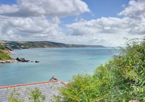 Enjoy spectacular views over Looe town, Looe Bay and the open sea beyond