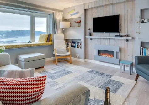 Dawn End, Looe is a spectacular hillside retreat with breathtaking bay views and coastal charm. Enjoy stylish interiors, tiered terraces, and easy access to beaches, perfect for couples or families seeking an unforgettable seaside escape.