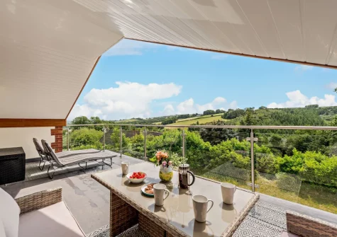 The balcony & alfresco dining area at Deer Lodge, High Bickington
