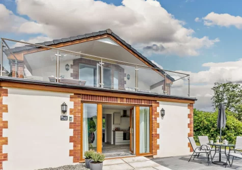 The decked patio & alfresco dining area at Deer Lodge, High Bickington