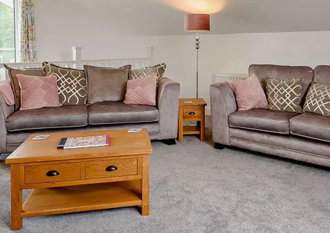 Deer Lodge, High Bickington is a serene woodland retreat with a private hot tub and impressive valley views. Perfect for couples and families seeking relaxation, rural charm and peaceful moments with easy access to North Devon's diverse attractions.