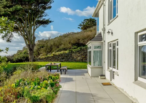 The terrace, alfresco dining area & lawned garden at Dene Court, Trenance