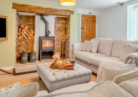 Deviock Farm House, Downderry is an elegant three-bedroom country retreat set in peaceful Cornish countryside, featuring original period details, a private hot tub for seven, and beautifully landscaped gardens, with coastal villages nearby.