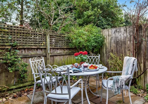 The enclosed patio garden & alfresco dining area at Devon's Traphouse Cottage, Winkleigh