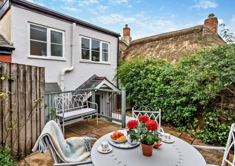 The enclosed patio garden & alfresco dining area at Devon's Traphouse Cottage, Winkleigh