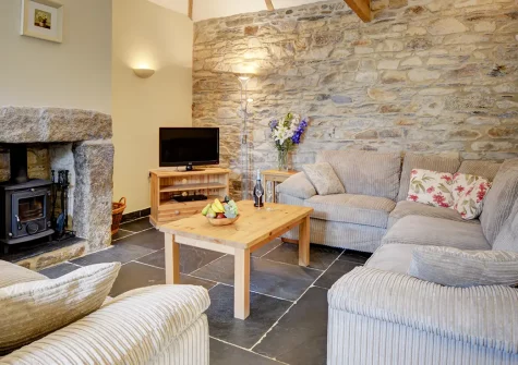 Dickins' Cottage, Trenarlett Farm is a luxurious converted barn for four guests. Enjoy charming barn features, comfortable well-appointed bedrooms, and direct access to beautiful Bodmin Moor, stunning beaches, and wonderful attractions.