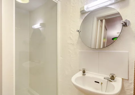 The shower room, accessed via bedroom #1, at Dingley Cottage, Porkellis
