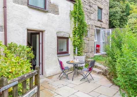 The patio, barbecue, outdoor sitting area & garden at Dingley Cottage, Porkellis
