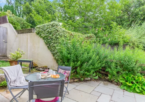 The patio, barbecue, outdoor sitting area & garden at Dingley Cottage, Porkellis