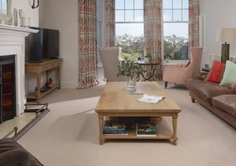 Dolly's Plaice, Fowey is a luxurious ground-floor apartment on the sought-after Esplanade with stunning coastal views. Enjoy elegant Victorian interiors, two en-suite bedrooms, and immediate access to beautiful Readymoney Cove for seaside bliss.