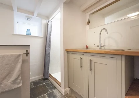 The shower & utility room at Dolor Cottage, Coverack