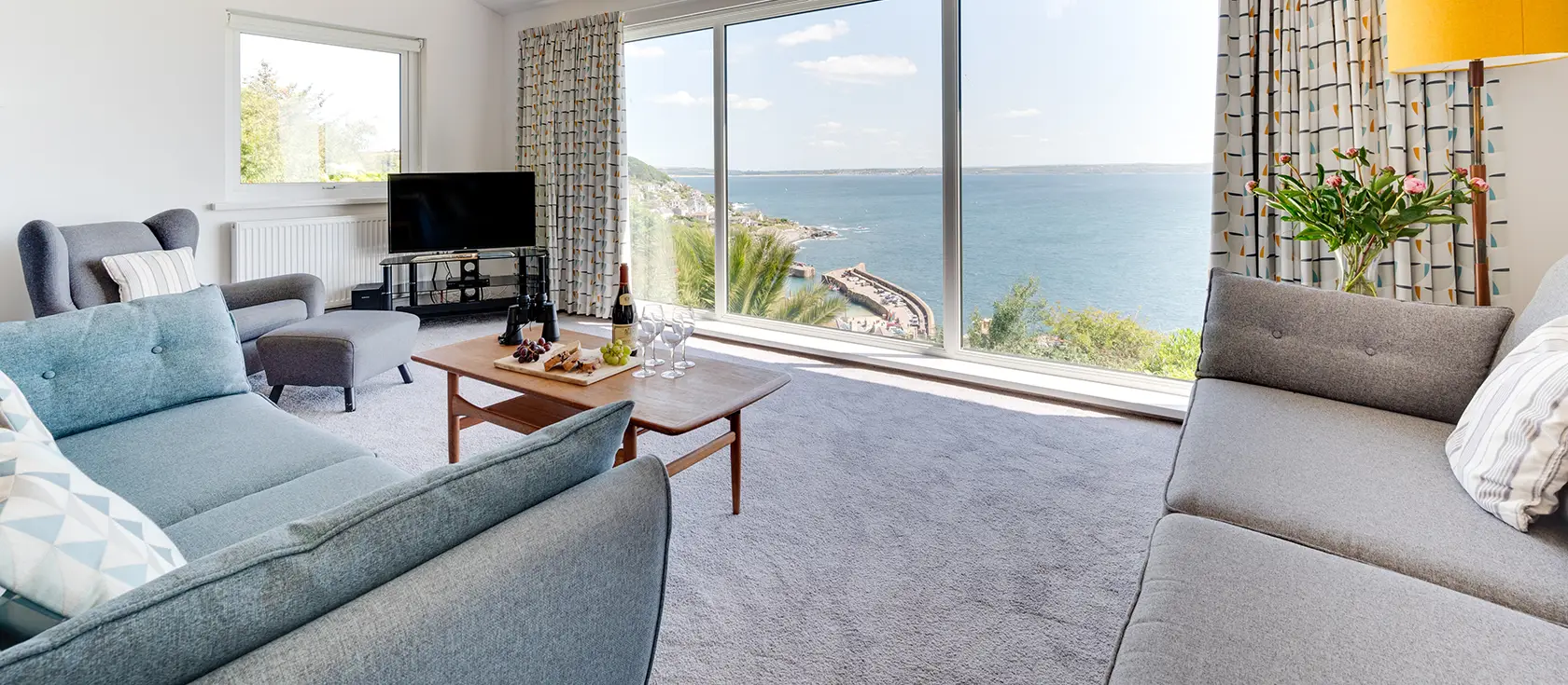 Dolphin Rise, Mousehole is a stunning four-bedroom contemporary retreat boasting panoramic sea views. Enjoy split-level living, modern amenities, and a spectacular large balcony overlooking the harbour, perfect for unforgettable coastal escapes.