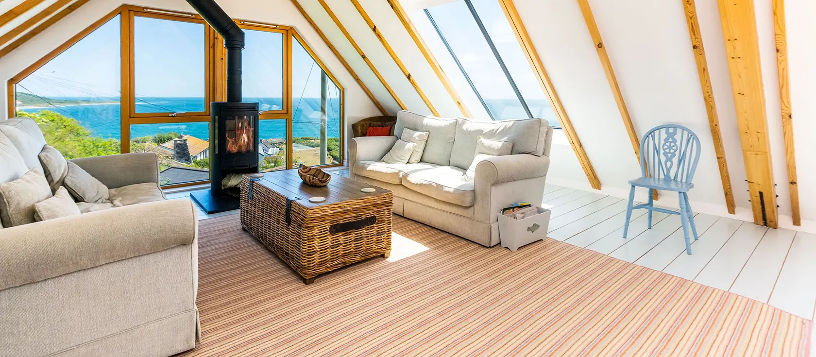 Dolphins, Coverack is a stunning upside-down house with spectacular panoramic sea views stretching over this charming fishing village. Enjoy contemporary comfort, tropical gardens, sun house retreat, and easy access to Cornwall's finest attractions.