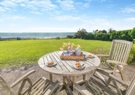 The patio, outdoor sitting area & lawned garden at Dolphins, Downderry