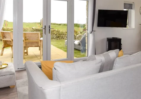 Dove Cottage, St Just is a stylish single-level retreat featuring a sumptuous bedroom with super-king bed, luxurious hot tub, and private terrace - all within easy reach of Cornwall's most stunning coastline, iconic landmarks, and sandy beaches.