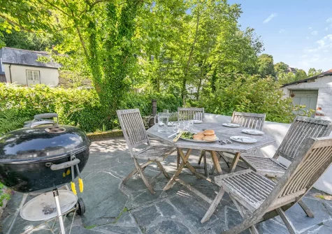 The patio, barbecue & alfresco dining area at Dowr Penty, Helford