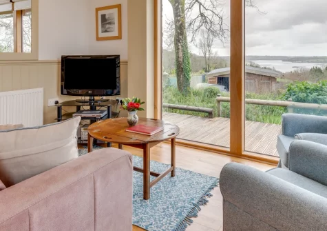 Driftwood Cottage, Bere Alston is a charming one-level stone barn conversion with breathtaking Tamar estuary views. Unwind on the wrap-around deck, discover Devon's rich heritage, and embrace the perfect rural retreat for families and couples alike.