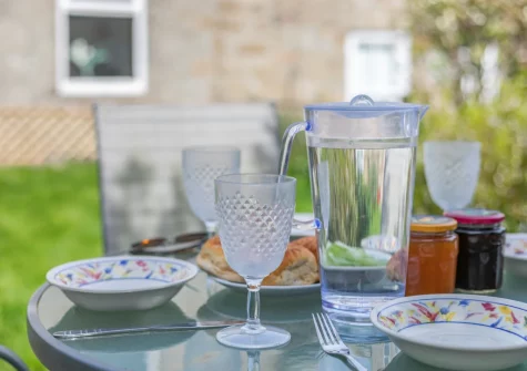 The decked patio & alfresco dining area at Driftwood Cottage, Mousehole