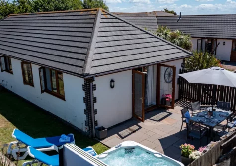 The courtyard, barbecue, alfresco dining area, hot tub & garden at Duck Egg Cottage, Westward Ho!