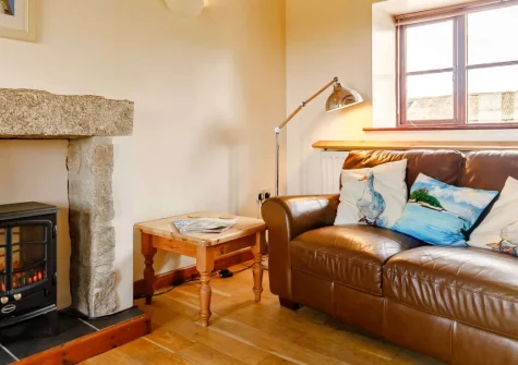 Duck's Waddle, Trevegean is a romantic barn conversion on a peaceful West Cornwall smallholding, featuring original beams, a four-poster bed, and stunning sea views towards Gwynver Beach, with the dramatic South West Coast Path on the doorstep.