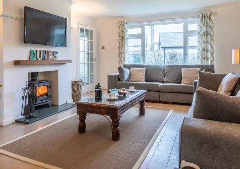 Dunes at Westcroyde, Croyde is a spacious four-bedroom family house in this celebrated surfing village, featuring a large enclosed garden, wood burner, and views across the dunes to the sea, just a gentle stroll from golden Croyde Beach.
