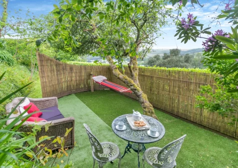 The beautifully landscaped garden & outdoor sitting areaa at Edgehill, Pentewan
