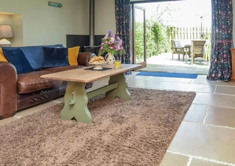 Edistone Barn, Edistone is a characterful three-bedroom barn conversion nestled in stunning coastal Devon. Enjoy rustic exposed beams, cosy underfloor heating, and a large enclosed garden with BBQ, perfect for unforgettable family escapes.