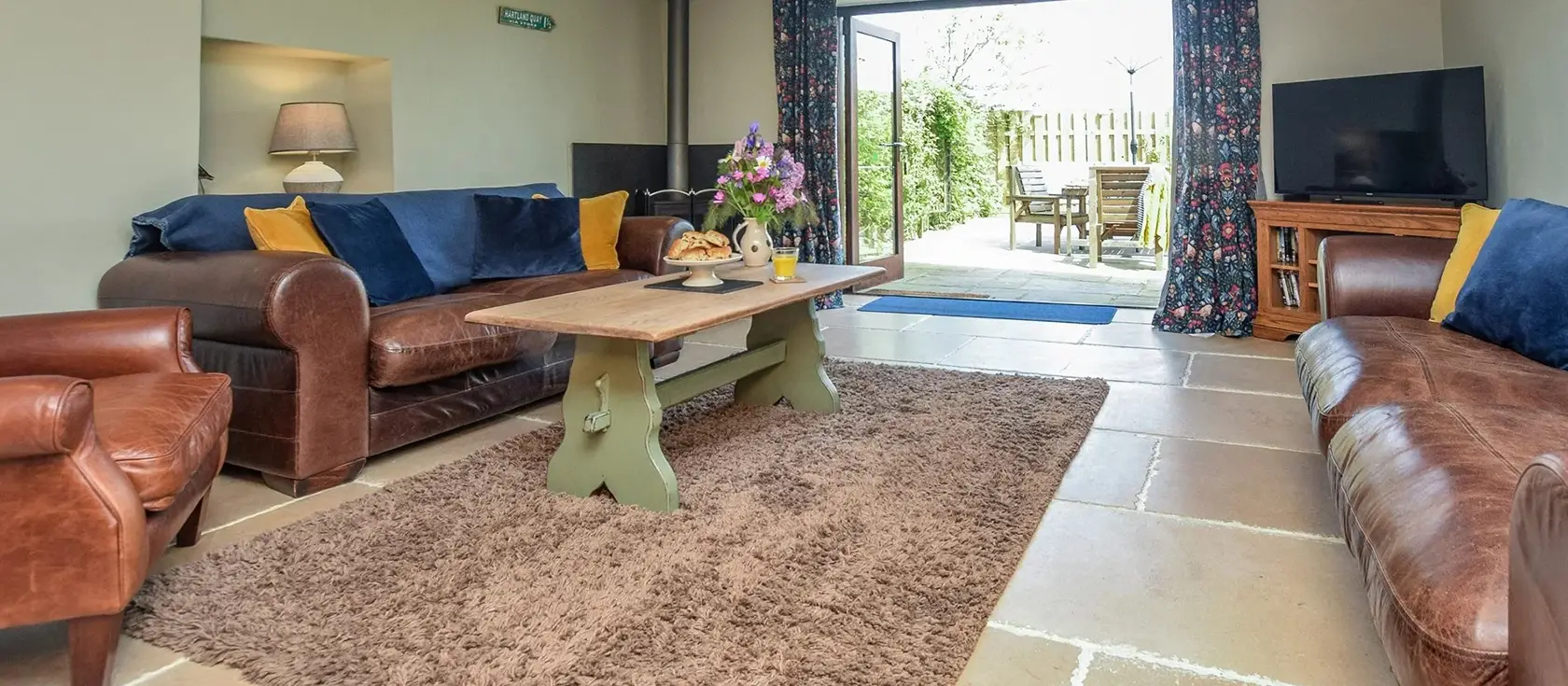Edistone Barn, Edistone is a characterful three-bedroom barn conversion nestled in stunning coastal Devon. Enjoy rustic exposed beams, cosy underfloor heating, and a large enclosed garden with BBQ, perfect for unforgettable family escapes.