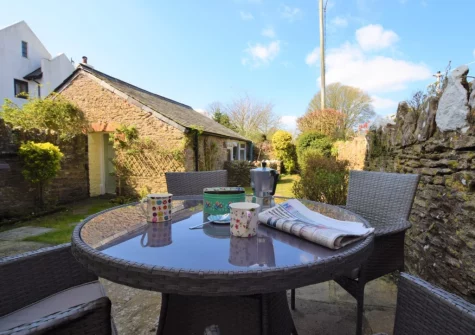 The patio & alfresco dining area at Elberry Cottage, Churston Ferrers