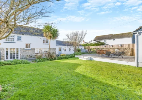 The patio & enclosed rear garden at Elmwood Cottage, Constantine Bay