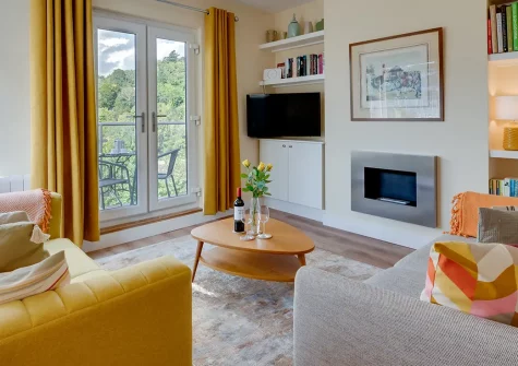 Emily's, Kingswear, is a beautifully designed two-bedroom apartment with stunning River Dart views. Enjoy stylish interiors, a bioethanol fire, and a private balcony. Perfectly placed for exploring historic Dartmouth and South Devon's coast.