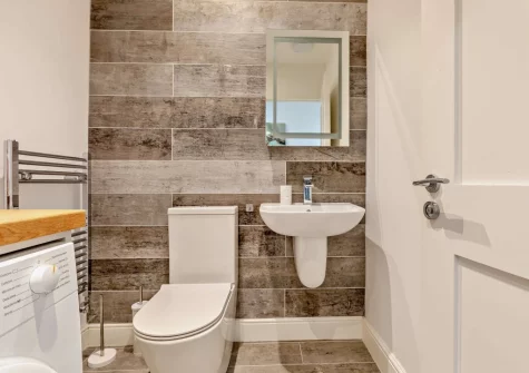 The separate WC with a washing machine at Enderley, Mortehoe