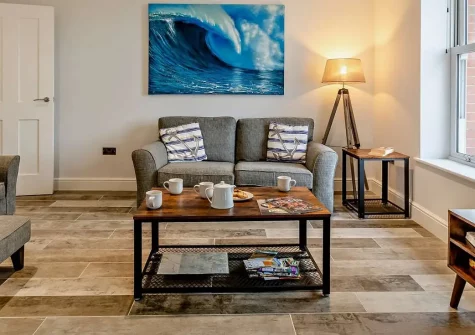 Enderley, Mortehoe is a stunning contemporary first-floor apartment with breathtaking coastal views across the Bristol Channel. Enjoy dual-aspect open-plan living, peaceful landscaped shared gardens, and easy access to golden sandy beaches nearby.