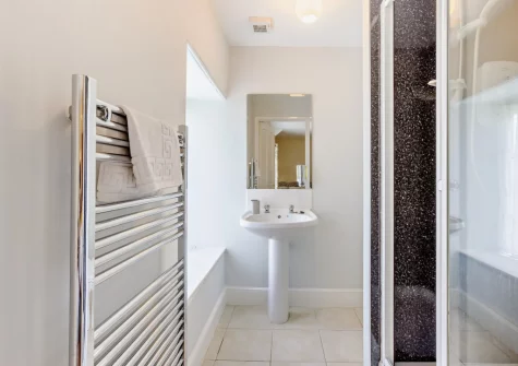 Bedroom #1 en-suite shower room at Estrayer Park Farmhouse, Meldon