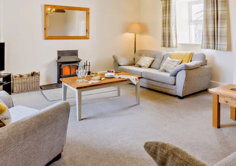 Estrayer Park Farmhouse, Meldon is a substantial six-bedroom retreat set in acres of private Dartmoor farmland, featuring spacious entertaining areas, a games barn, sweeping lawns for family activities, and easy access to moorland walks and cycling.