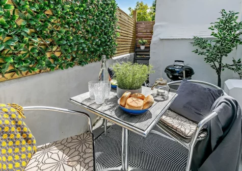 The patio terrace, barbecue & alfresco dining area at Estuary Cottage, Hayle