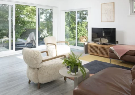 Estuary Watch, Lelant is a stunning five-bedroom holiday home boasting triple-aspect living spaces, two water-view balconies, and a private garden, positioned mere minutes from Porthkidney Sands and St Ives' galleries and beaches.