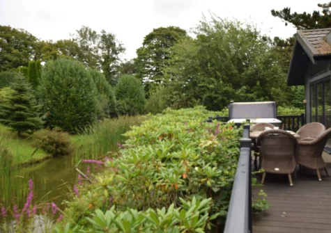 The decked patio, alfresco dining area & hot tub at Exmoor View at Kentisbury Grange, Kentisbury