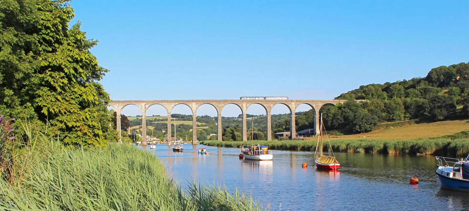 Leaving the city of Plymouth behind you, immerse yourself in the views of the Tamar Valley. Take a window seat and enjoy the rolling countryside, sleepy villages and tranquil river crossings. The highlight of the journey is when the train slowly creeps down over the Calstock viaduct and you are 120 feet high looking down on the river below. Look closely out of the window and see the National Trust house Cotehele nestled in the woods.