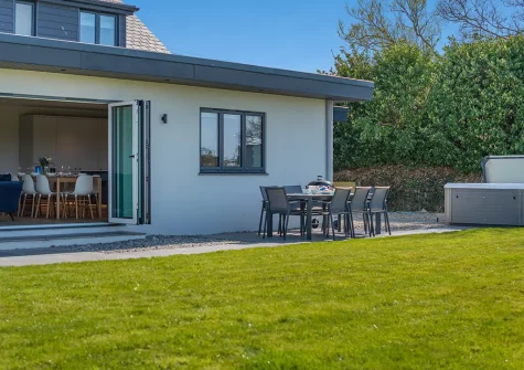 The patio, barbecue, alfresco dining area & hot tub at Fair Skies, St Merryn