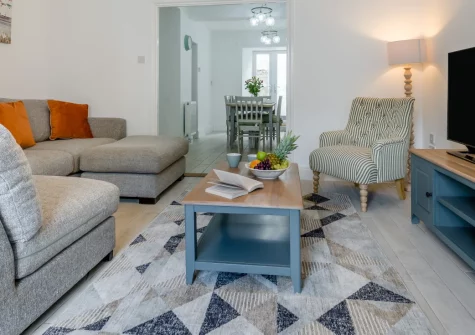Fairbank House, Looe is a bright four-bedroom family home in the heart of this charming fishing town, featuring an elevated sun deck, elegant interiors, and East Looe Beach, harbour restaurants, and coastal boat trips all within easy reach.