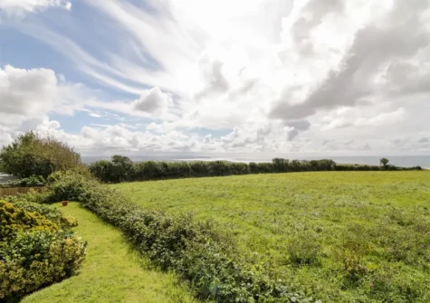 Enjoy beautiful views over farmland towards the sea when you stay at Fairways, Bush